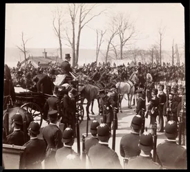View of the crowd and military men surrounding a carriage with President Harrison at Grant